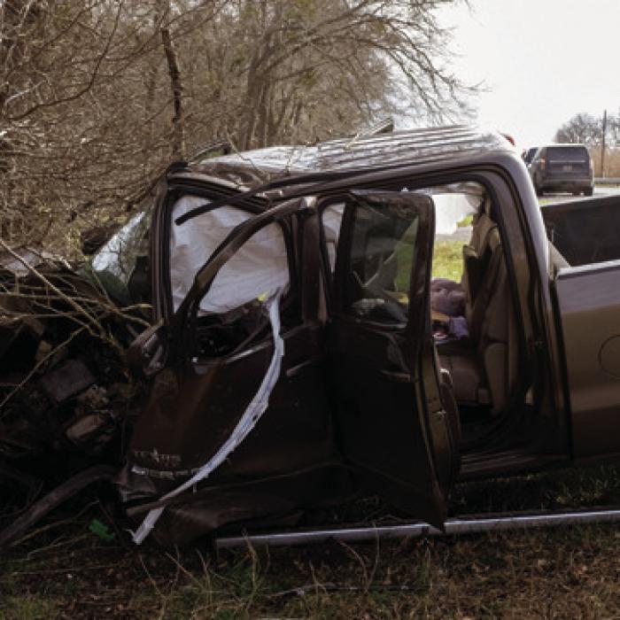 The driver of this GMC Sierra suffered serious injuries after his pickup went off the road and hit a tree near Mullins Prairie Thursday. Photo by Andy Behlen