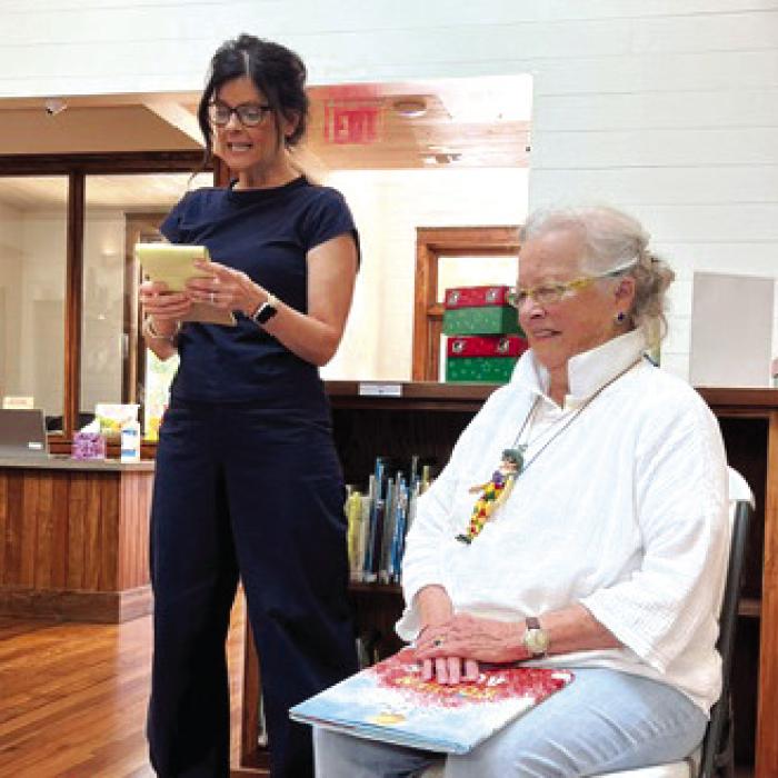 Laura Childs, RTFL Children’s Program Coordinator, introduces Sally Reynolds, who read books for the children at the RTFL Children’s Storytime New School Year Kickoff.