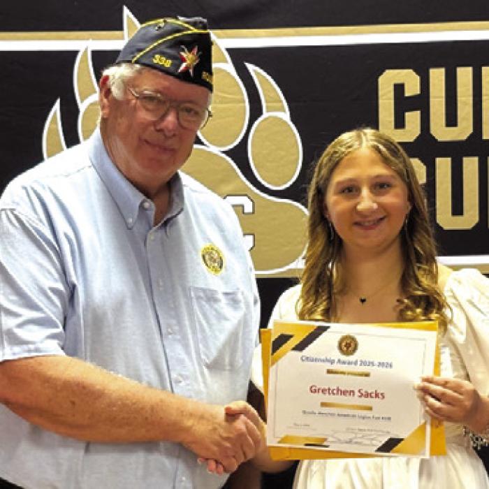 Lyn Reavis, Post Commander of American Legion Post #338 presents the Citizenship Award and Scholarship to Gretchen Sacks of Round Top-Carmine High School.