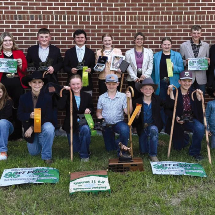 Pictured front from left: Hayleigh Pizzitola, Crockett Guenther, Abigale McBride, Jehnsen Janecka, Joe Carrales, Hudson Holub, Rowdy Guenther and Tate Fritsch; back row: Hailey Janish, Coaches Kaci and JoJo Carrales, Rheagan Karisch, Abraham McBride, Logan Poncik, Kaisley Janecka, Adalyn Carrales, Brealey Nieto, Holden Holub, Rilan Karisch, Tatum Fritsch and Keeley Warnken.