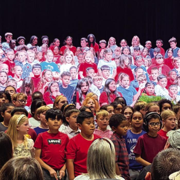 La Grange Elementary School held a touching Veterans Day Program split into two parts. Kindergarten-2nd graders performed at 1:30 p.m. and 3rd-6th graders performed at 2:30 p.m. At the conclusion of the second performance more than 400 students piled into the front of the stage for a powerful conclusion (above). In addition to a packed house of parents and grandparents, several veterans from the community were on hand, in reserved spots on the front rows, for the performance. Photo by Jeff Wick