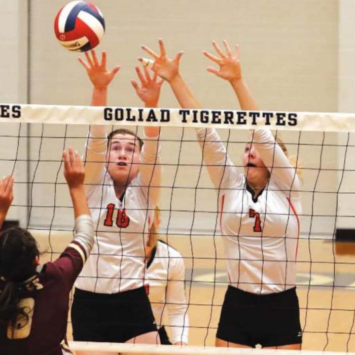Schulenburg’s Morgan Marburger, 18, and Kloe Kutac, 7, jump to try to block this Pettus hit Thursday. Photos by Audrey Kristynik