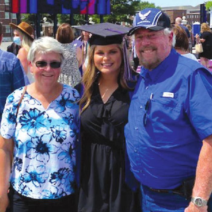 Pam and Ron Knotts with granddaughter Keylee Simpson at the University of Central Arkansas graduation ceremony.