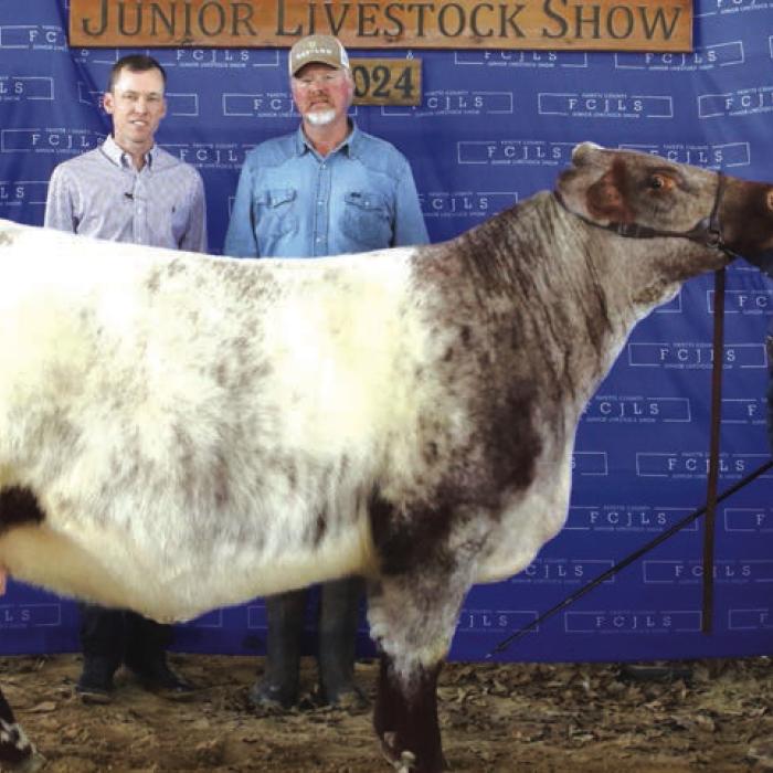 GRAND CHAMPION HEIFER OVERALL &amp; GRAND CHAMPION HAIRED HEIFER– CASH SMITH, FAYETTEVILLE 4-H &amp; FFA; Grand Champion Buckle Sponsor – KPK Manufacturing Indie Sikes – Holding Banner, Judge Caleb Boardman, Todd Smith, Cash Smith and Bradley Klesel – KPK Manufacturing