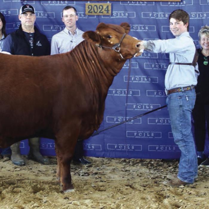 RESERVE CHAMPION HEIFER OVERALL &amp; GRAND CHAMPION AMERICAN HEIFER -- COOPER MAU, FAYETTEVILLE 4-H &amp; FFA; Reserve Champion Buckle Sponsor – In Memory of Frankie Joe Cernosek; Jeslyn Moralez, Harper Mau, John Mau, Judge Caleb Boardman, Cooper Mau, Karolyn Mau, Nettie Cernosek – In Memory of Frankie Joe Cernosek, and Sawyer Mau
