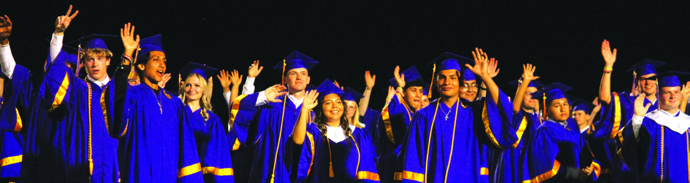 Members of the La Grange senior class wave to the crowd after they had all received their diplomas Thursday. Photo by Jeff Wick