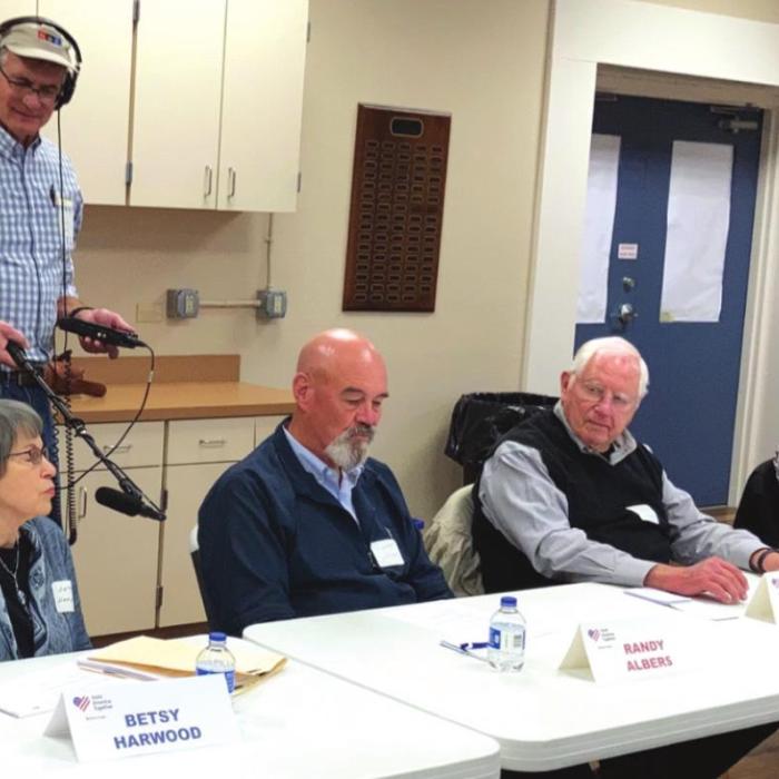NPR reporter John Burnett records as Braver Angel participants, from left, Betsy Harwood, Randy Albers, Jim Ayers and Chuck Mazac express their views. The workshop was held Feb. 17 at Randolph Recreation Center in La Grange.