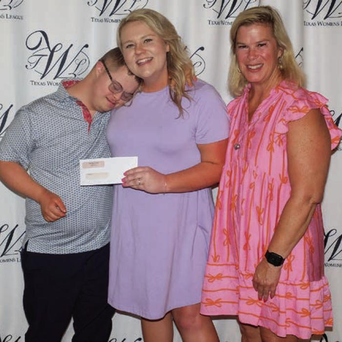 And Then A New Day (ATAND, LLC) received a $3,700 grant. Representing ATAND were Will Keilbach (left) and his mom Meg Keilbach (right). Presenter was Tiffany Surman (center).
