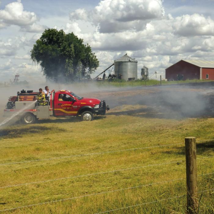 La Grange firefighters battled a grass fire on Egypt Rd. near Plum Monday, Aug. 1. Photo by Andy Behlen