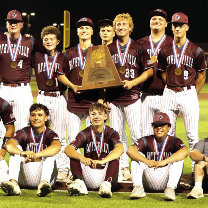 Fayetteville players and coaches pose with their medals and the Conference A state semifinalist trophy after their loss to Centerville. Photo by Ken Sury