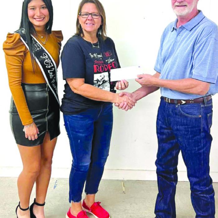Second runner up Andrea Ortiz represented Fayette County Sheriff’s Posse who received a donation of $2,366.00. Pictured from left: Andrea Ortiz, FCSP representative Deanna Toddy and Fair President Mike Zuhn.