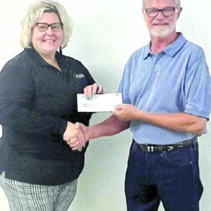 First runner up Camryn Alvarado represented Kyla Faith Memorial who received a donation of $2,513.00. Pictured from left: KFM representative Shannon Hemmitt and Fair President Mike Zuhn.