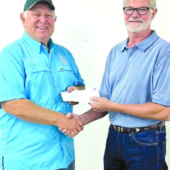 Brisa Sota represented La Grange Noon Lions Club who received a donation of $1,682.00. Pictured from left: Lions Club representative Mark Ulrich and Fair President Michael Zuhn.