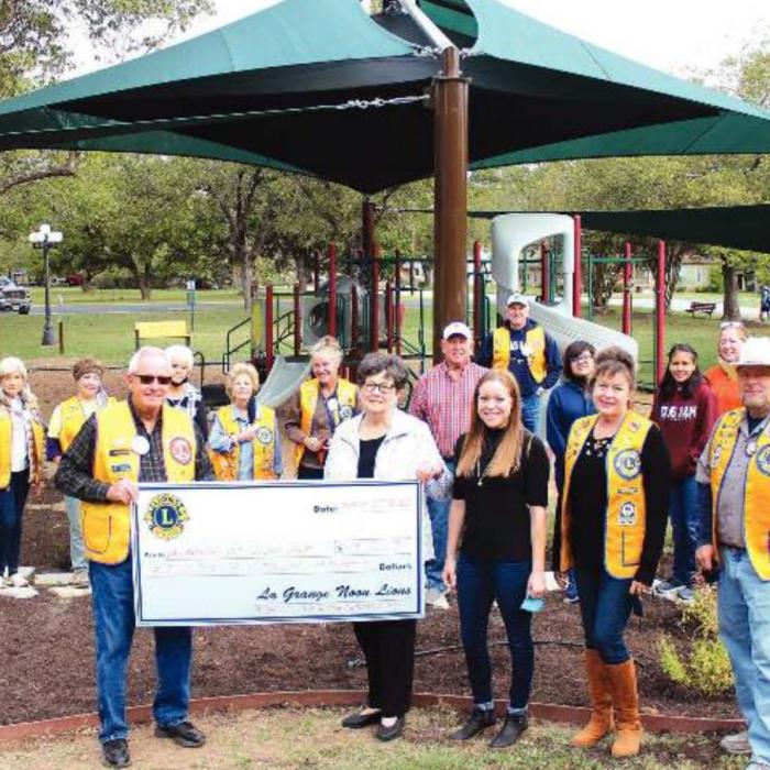Pictured receiving the grant are Lion Ken Morris, Mayor Janet Moerbe, Library Director Allison MacKenzie, Lions Diana and Sam Wilson. Photo by Jeff Wick