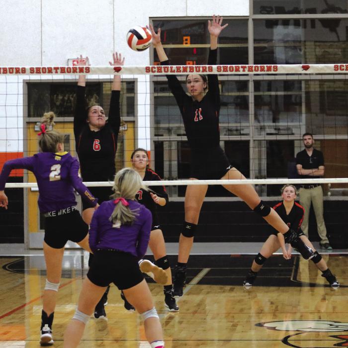 Schulenburg’s Meredith Magliolo really shows off her ability to get above the net in this photo from action Tuesday against Weimar. Also shown is her teammate Tamara Otto. Photo by Audrey Kristynik