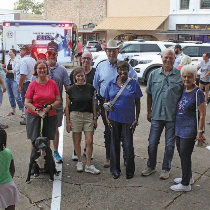 National Night Out event in downtown La Grange on Oct. 8 drew a big crowd. Shown here are city council members, Mayor Jan Dockery, Police Chief David Gilbreath and City Manager Jack Thompson taking a break from the festivities to pose for a photo. Photo by Jeff Wick