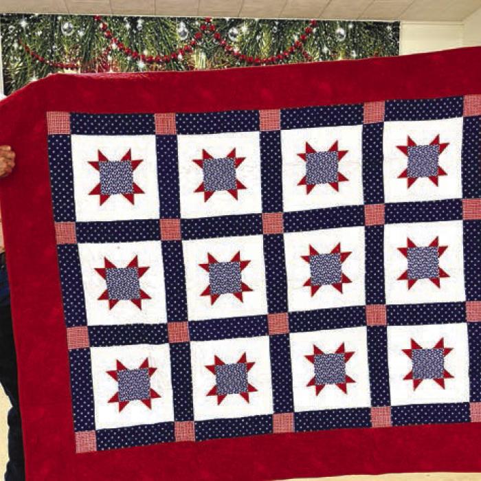 Quilt of Valor recipient Jim Holub with VFW Commander Richard Gray.