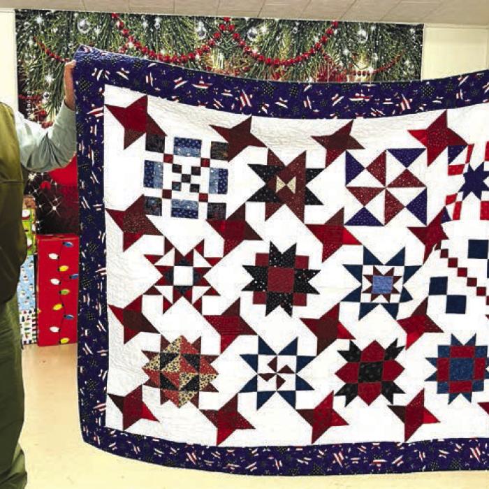Quilt of Valor recipient Erwin Sladek with VFW Commander Richard Gray.