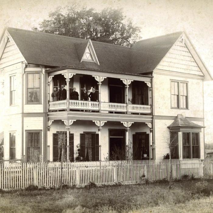 This 1890s photograph pictures Augusta (Willenberg) and William Hermes, Jr., Louise (Holste) and Dr. William Hermes, and August Hermes on the upper balcony of William Hermes, Jr.’s home, at 541 North Main Street, La Grange.