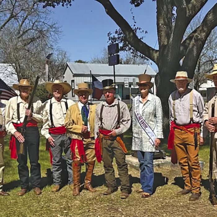 The City of Round Top hosted a Texas Independence Day celebration on the town square Sunday March 2. The Lions Club put up both Texas and American flags around the Square (as they do for every patriotic holiday) and then at noon the Cannoneers and Mayor Judith Vincent said the Pledge of Allegiance, Pastor Matthew Diehl lead the group in The Lord’s Prayer, and then the Cannoneers fired the cannon. Above is the cannon going off, left. Right is the cannon crew along with mayor Judith Vincent.