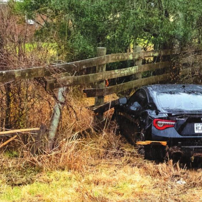 A crash hydroplaned on SH 159 and crashed into a fence during the rain on Monday morning, Jan. 31. Photo by Andy Behlen