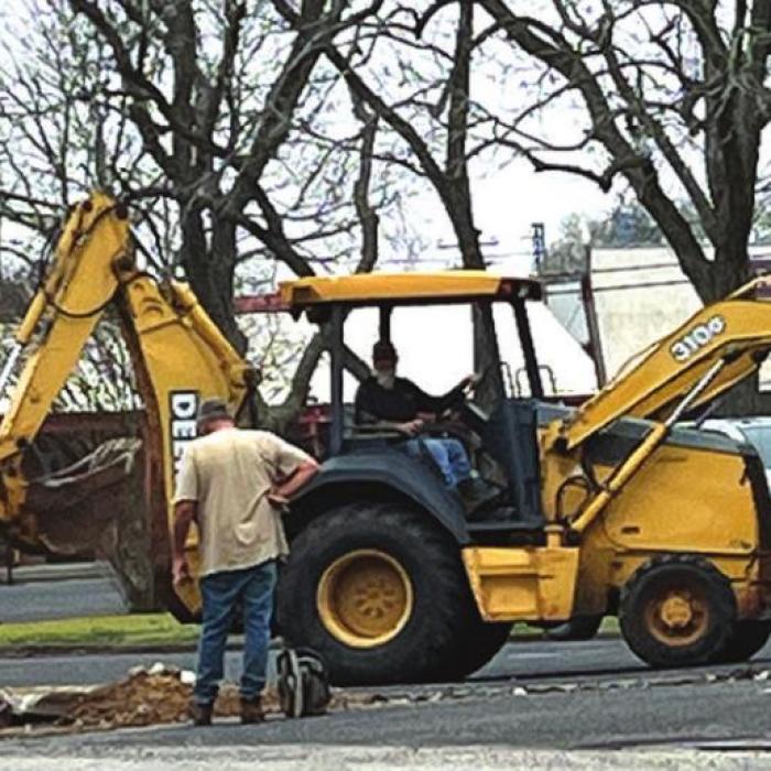 Curb removal from parking area of old fire station.