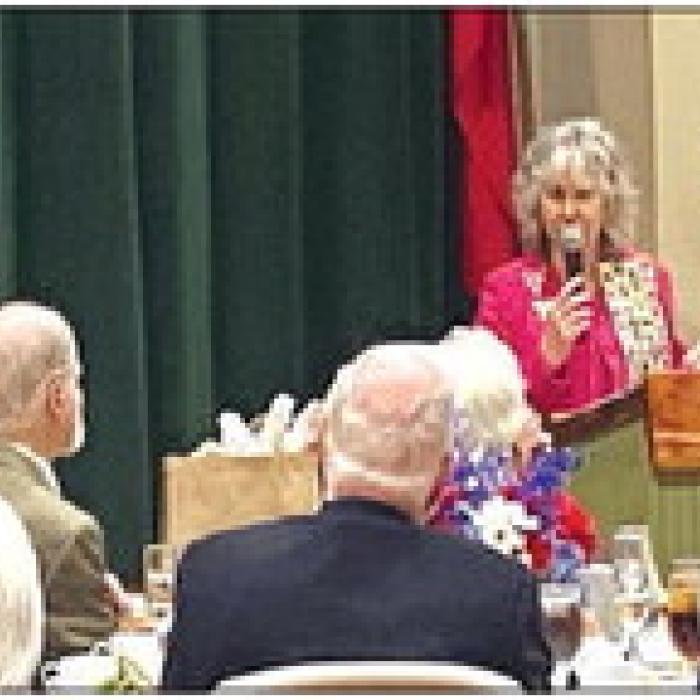 Guest speaker, Georgi Anne Uribe Brochstein, discusses the work of the E Pluribus Unum Committee of NSDAR.