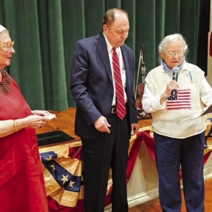 The Honorable Judge Dan Mueller accepts the Smith-McMillan Chapter’s Appreciation Award and Medal from Sarah Mabry and Sally Reynolds.