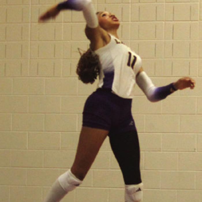 La Grange’s Brion Williams gets a lot of air on a jumpserve in Tuesday’s match. Photo by Jeff Wick