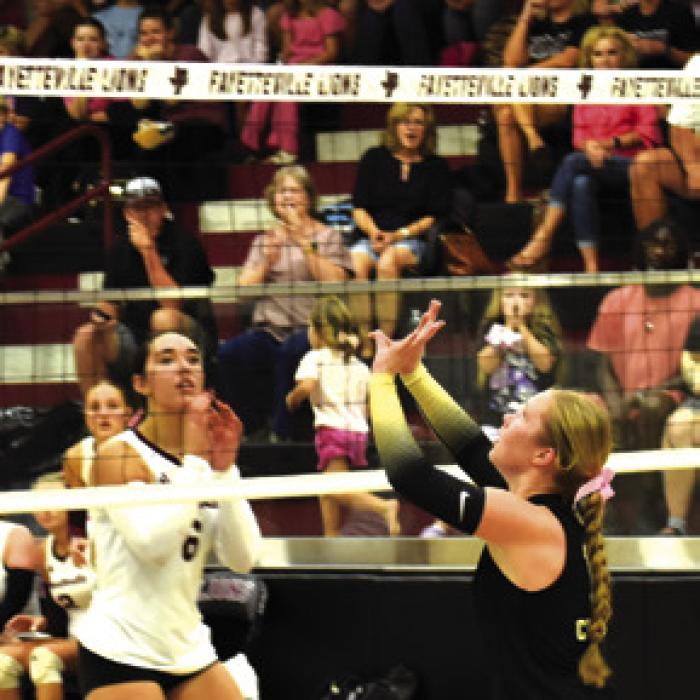 Round Top-Carmine’s Madison Markwardt sets a ball Tuesday as Fayetteville’s Lilly Aldape readies on the other side of the net. Photo by Paul Kipp