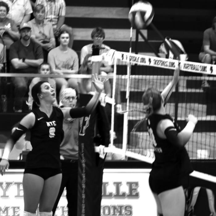 Left to right: Bree Dooley and Rebekah Sacks at the net for RTC in Tuesday’s win. Photo by Paul Kipp