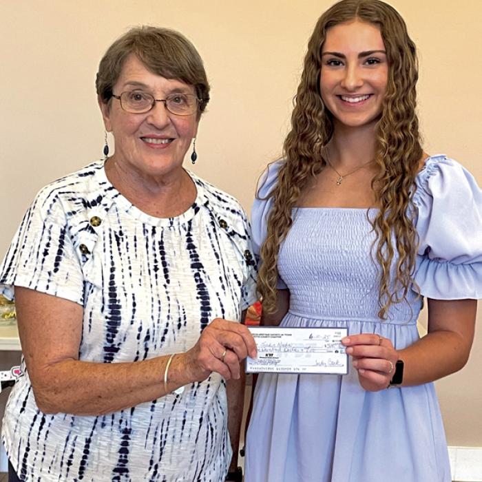 Carolyn Heinsohn presenting Sadie Noska the CHS Scholarship check.