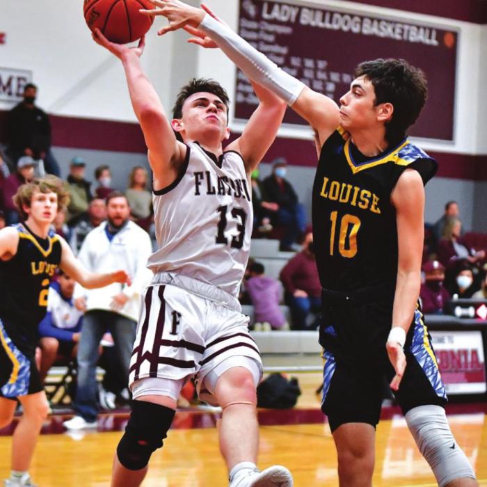 Luke Law scores for The Flatonia Bulldogs earlier this month when they beat Louise to clinch the district title. Photo by Stephanie Steinhauser