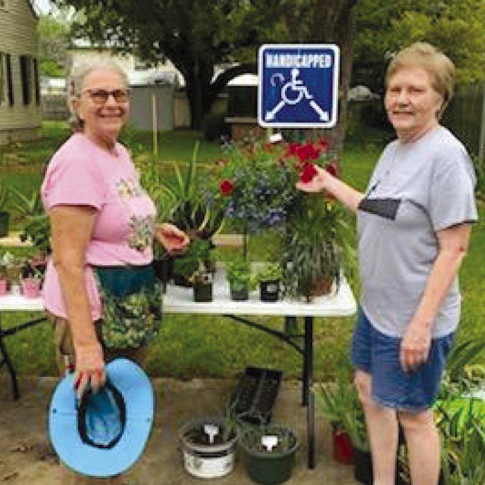 Member Patty Sbovada and President Mariam Tajchman made sure everything was ready for the big two day Caladium plant sale.