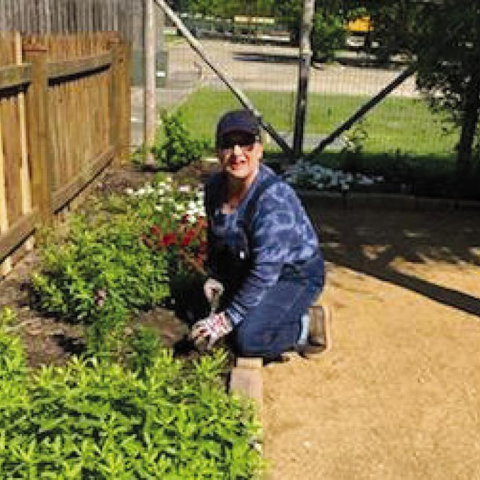 Sherri Ahart added spring color plants to the Grandmother’s Flower Garden located at the Texas Quilt Museum in downtown La Grange.