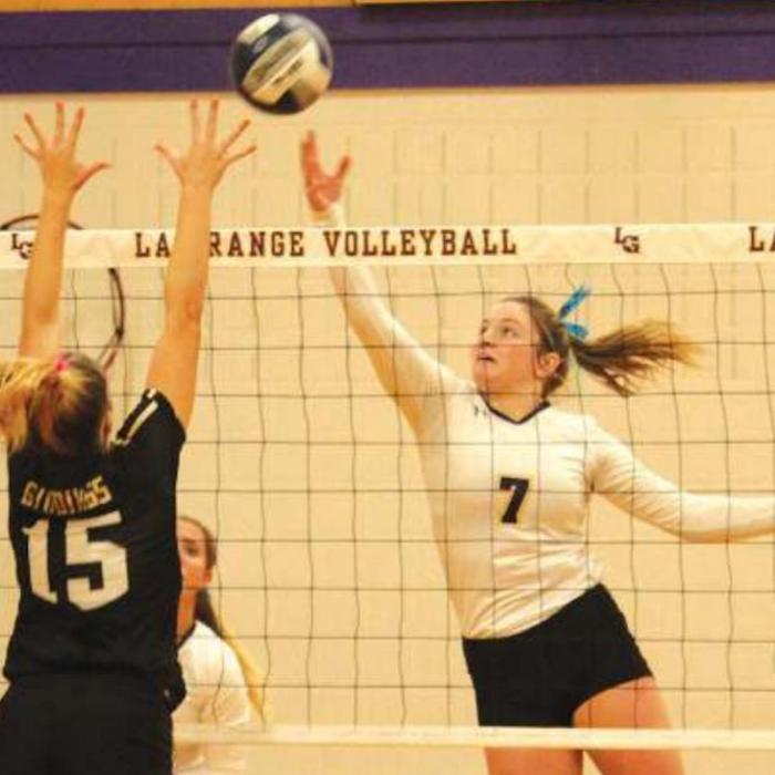 La Grange’s Natalie Blackwell tips the ball over in the match against Giddings last Saturday. The two teams face off again this Friday. Photo by Jeff Wick