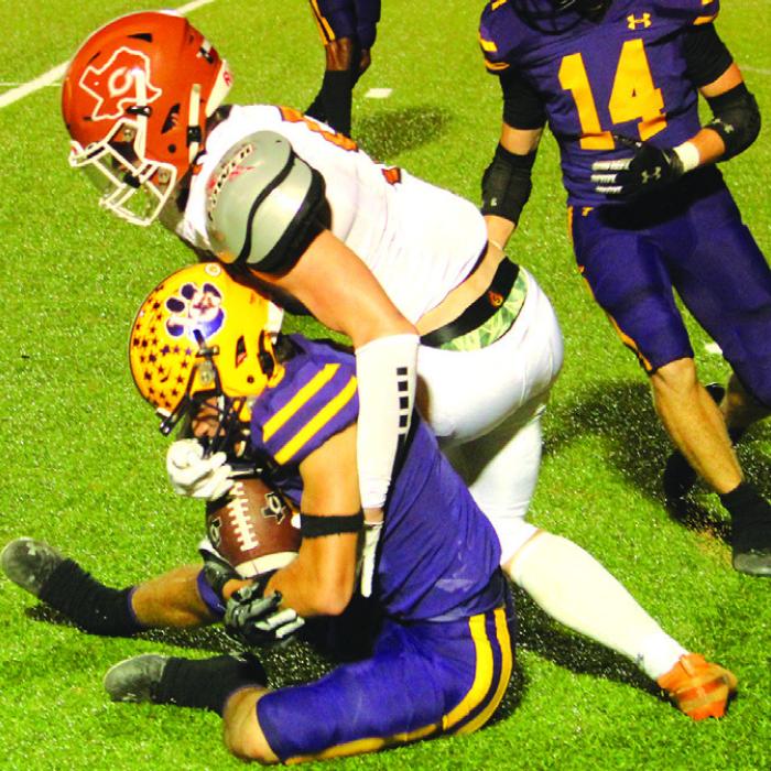 Leopard Max Dixon holds tight to this interception Friday. Photo by Jeff Wick