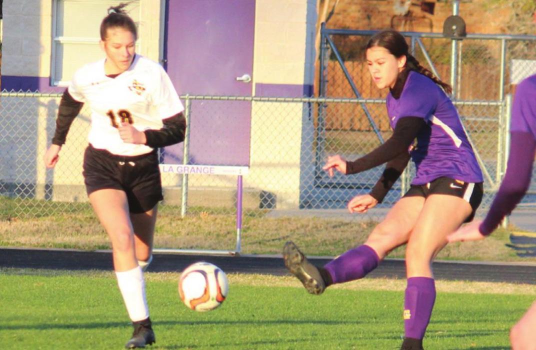 Jolie Gutierrez kicks the ball on the way to one of her three assists Friday. Photo by Jeff Wick