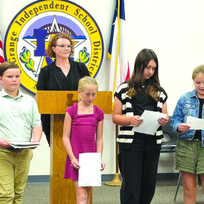 Members of the La Grange Elementary Lighthouse team gave a presentation to the board at Monday night’s meeting. Pictured here are Kolby Walker, Aubrey Gommert, Elyse McBroom, and Charlotte Crowley with Dr. Regina Walker in the background.