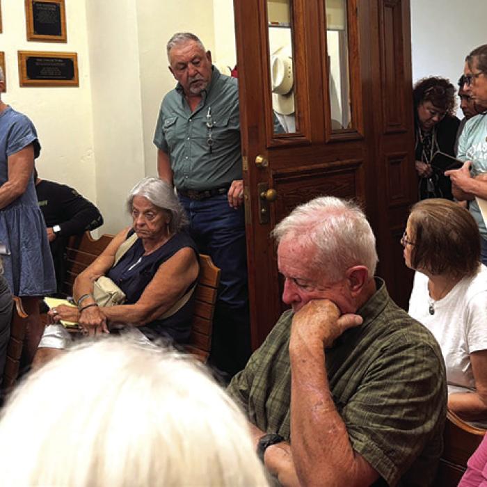 A standing room-only crowd filled the Commissioners Court meeting room last Friday for a special meeting over the County’s participation in Operation Lone Star. Photo by Andy Behlen