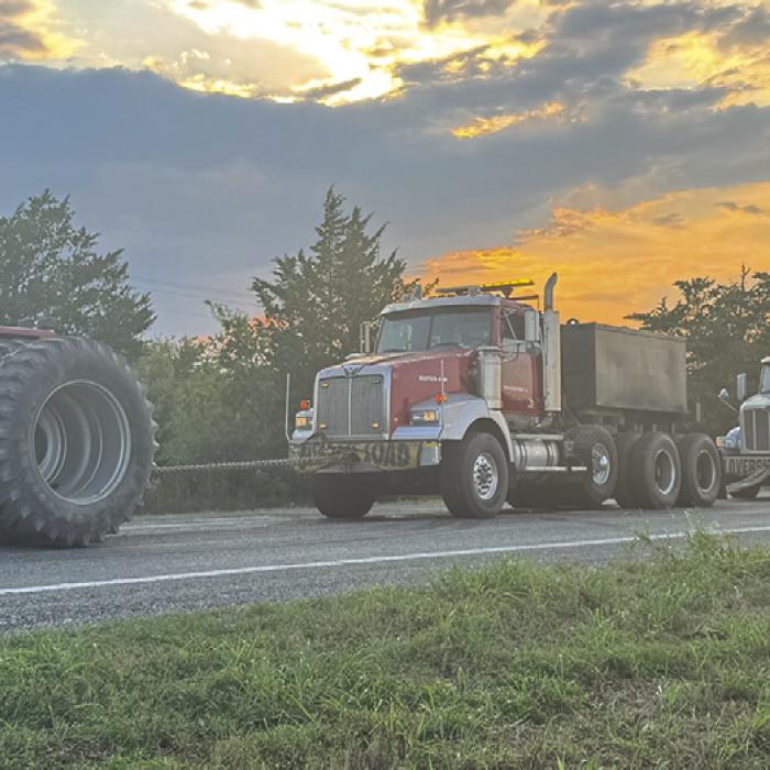 Hostyn Hospitality, and a Big Tractor, Gets Convoy Up the Hill