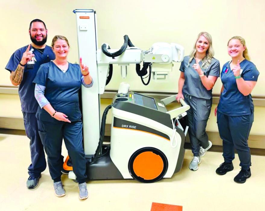 Noel Rios, Debra Meyers, Whitney Leer, and student Ally Trlicek, with St. Mark’s new portable digital radiology mobile unit.