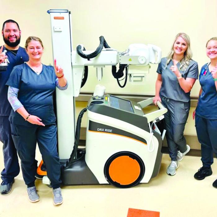 Noel Rios, Debra Meyers, Whitney Leer, and student Ally Trlicek, with St. Mark’s new portable digital radiology mobile unit.