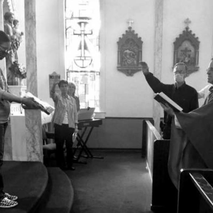 Every year, the St. Elizabeth #20 branch of KJZT Family Life Organization buys new flags for St. Cyril &amp; Methodius Church in Cistern. On August 2nd, Reverend Eddie Winkler blessed the flags, they were raised by Pat Lyons and Charles Vinklarek, and they are now flying outside the church.