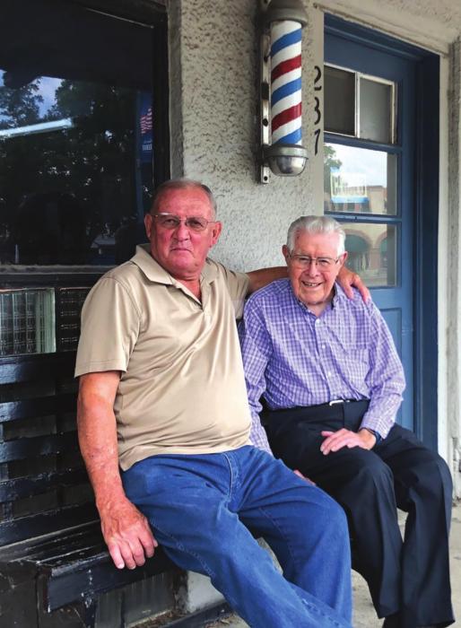 Longtime La Grange barber Ken Jurecka was joined by his friend and retired barber Charlie Ripper in late June to mark the end of an era. Combine the number of years the pair has been cutting hair, and you’re looking at more than a century of barbering at its best on the courthouse square in La Grange! (Elaine Thomas shot this photo several weeks before the state and citywide masking order.)
