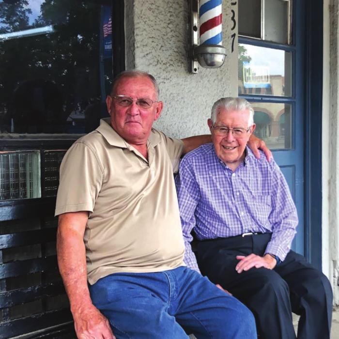 Longtime La Grange barber Ken Jurecka was joined by his friend and retired barber Charlie Ripper in late June to mark the end of an era. Combine the number of years the pair has been cutting hair, and you’re looking at more than a century of barbering at its best on the courthouse square in La Grange! (Elaine Thomas shot this photo several weeks before the state and citywide masking order.)