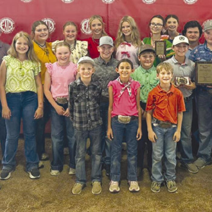 Front row: Joe Carrales, Emma Zwescpher, Rowdy Guenther, and Jehnsen Janecka; middle row: Tate Fritsch, Hayleigh Pizzitola, Abigale McBride, Hudson Holub, Parker Gabler, Crockett Guenther, Abraham McBride, and Coach Kaci Carrales; back row: Coach JoJo Carrales, Rilan Karisch, Hunter Gabler, Rheagan Karisch, Julia Melton, Hailey Janish, Sawyer Mau, Tatum Fritsch, Laramie Laake, Logan Poncik, Holden Holub, and Dylan Zwescpher.
