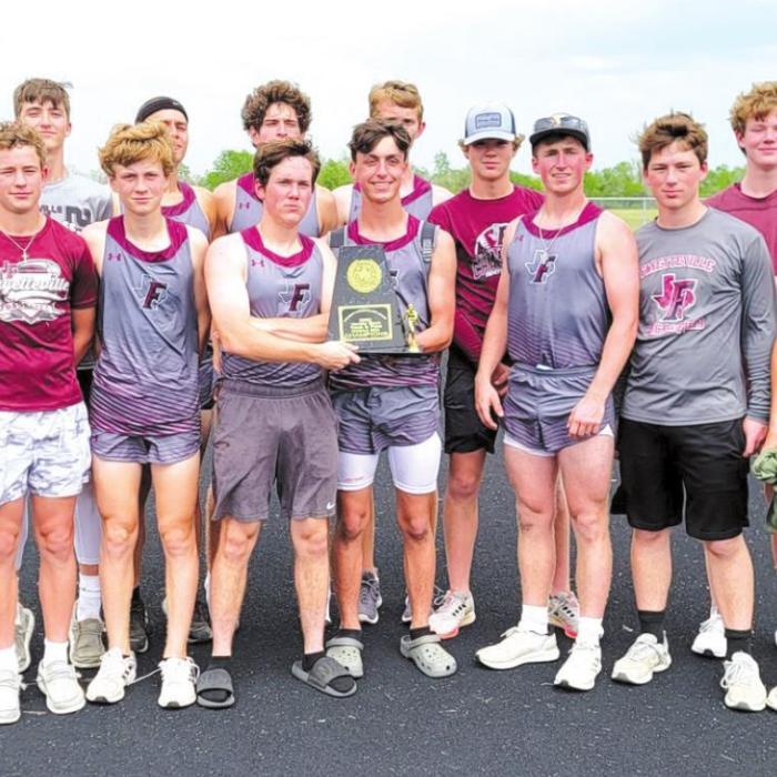 The members of the Fayetteville boys track team are shown above with their district team title trophy. They repeated the feat at area.