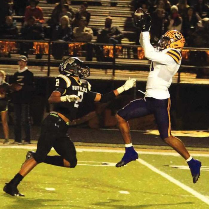 La Grange’s Bravion Rogers leaps to make this catch against the defense of Giddings’ Kolbie Clemons, and then would still be able to stay on his feet and run the ball into the endzone for a 57 yard touchdown Friday. Photo by Jeff Wick