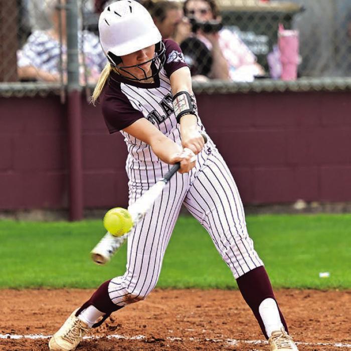 Brynlee Zimmerman puts the bat on the ball for The Flatonia Lady Bulldogs in Thursday’s win over Bloomington. Photo by Stephanie Steinhauser